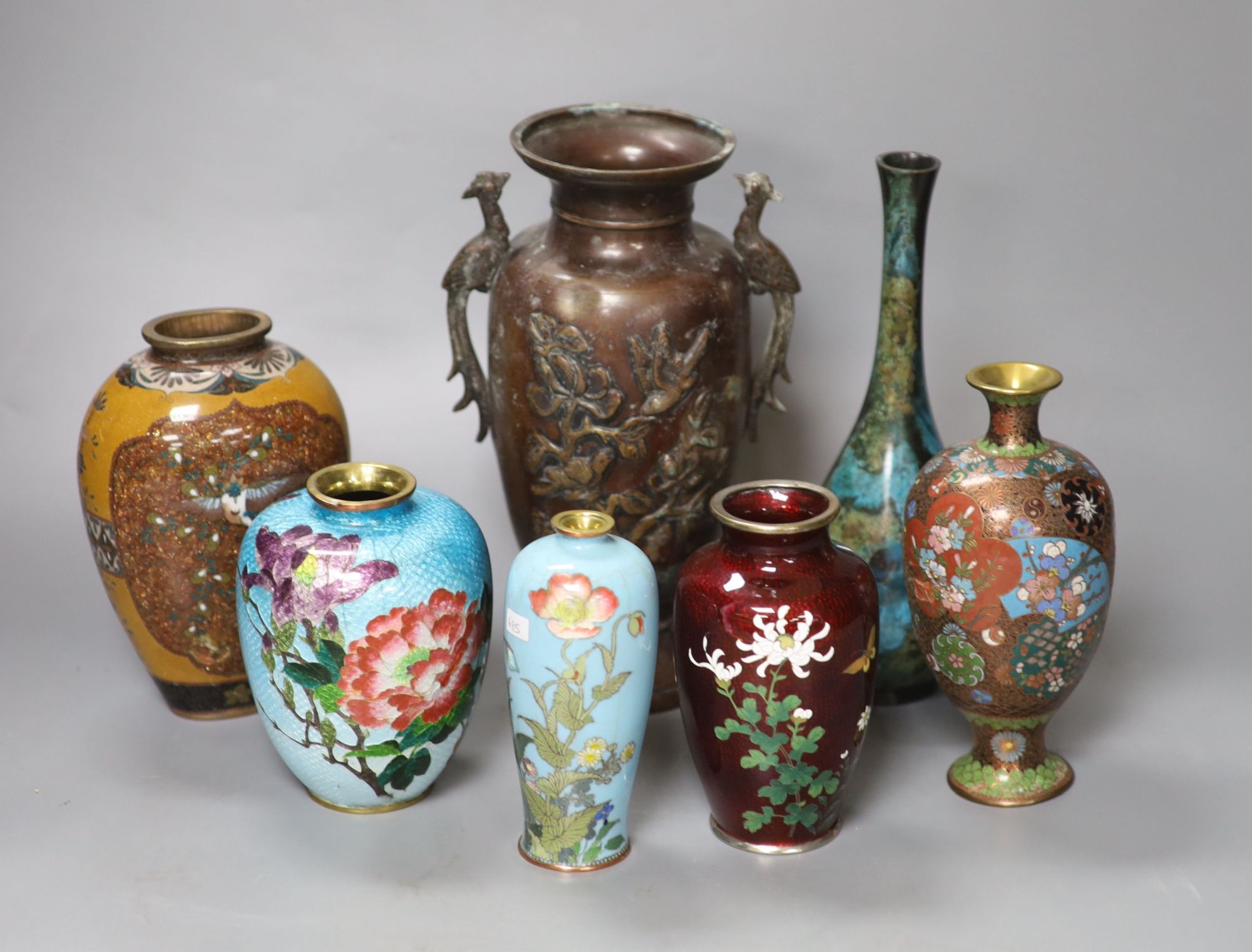 Seven Japanese vases including one bronze, five cloisonne enamel and a patinated bronze bottle vase, tallest 22cm